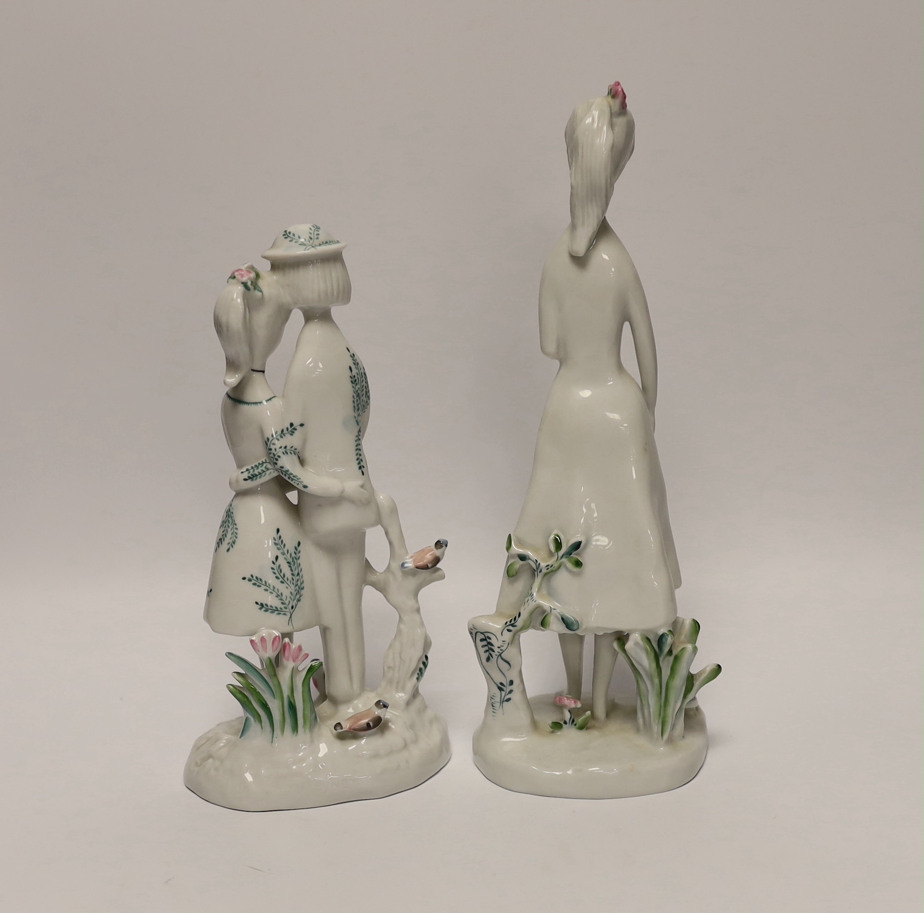 Two Rosenthal figures, a girl holding a heart and a figure group with a bird, tallest 26.5cm